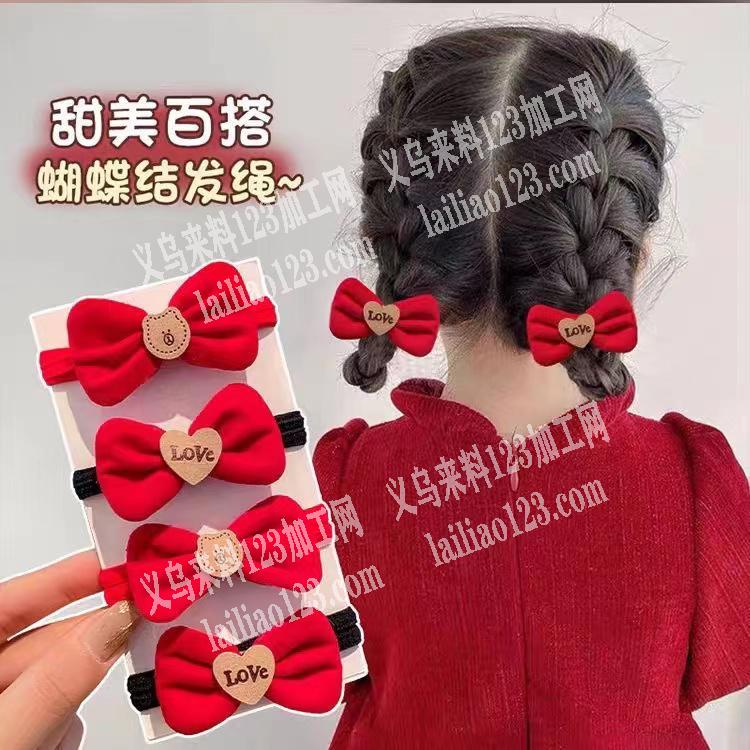 大量蝴蝶结粘在发圈上的手工活外发加工，如
