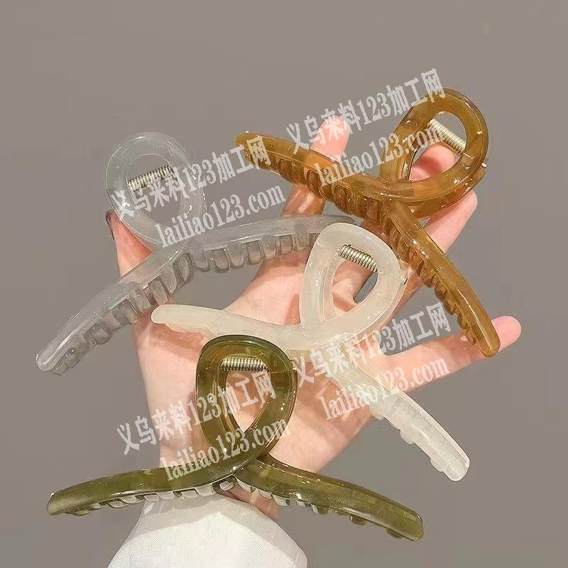 公司好几万抓夹订单，。如图，塑料的飘带抓