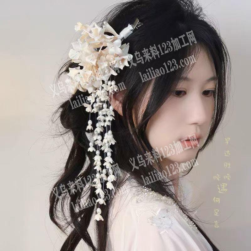 新娘花手工活。穿珠子的新娘花。寻找会做的
