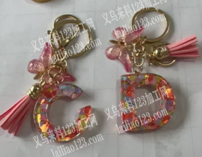 大量流沙入油钥匙扣配件订单，如图，寻找厂